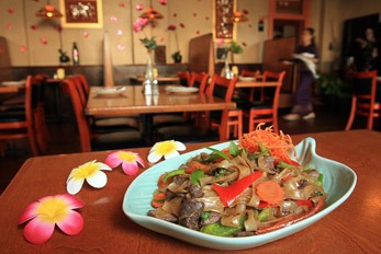 Thai food with flowers on a table